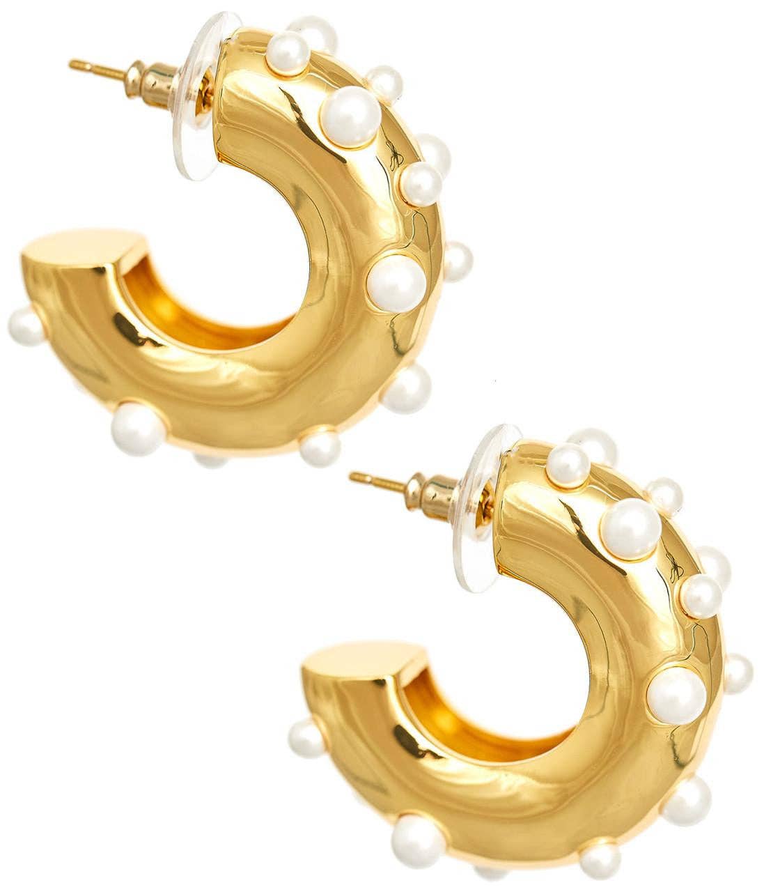 Gold hoop earrings with pearl accents on a white background