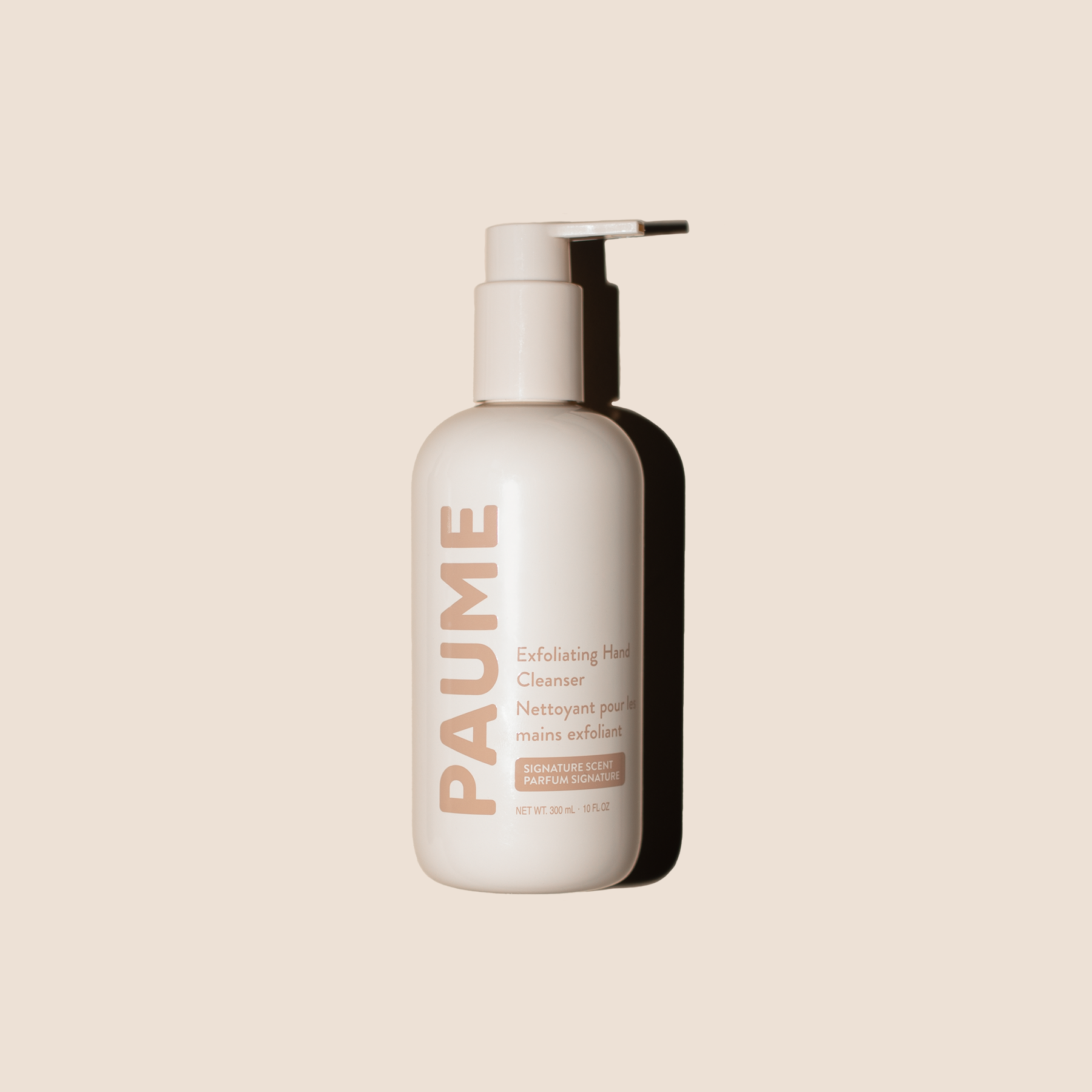 PAUME exfoliating hand cleanser bottle on a beige background