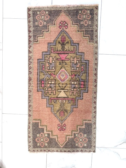 Decorative Turkish rug with central motif geometric pattern on a white floor