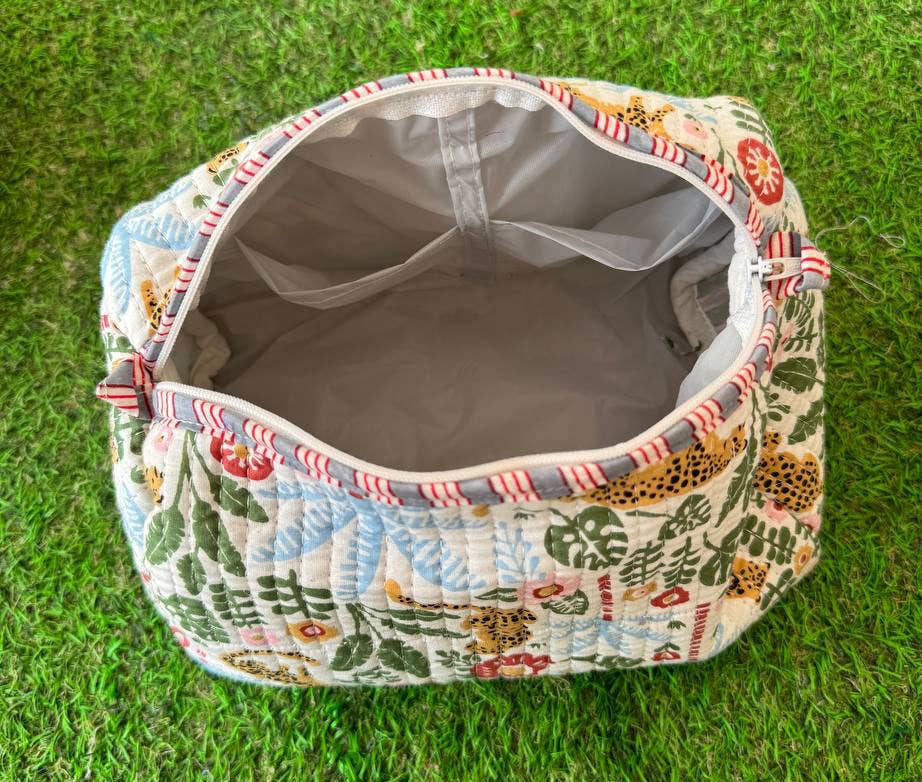 quilted fabric cosmetic bag showing waterproof lining and interior pockets